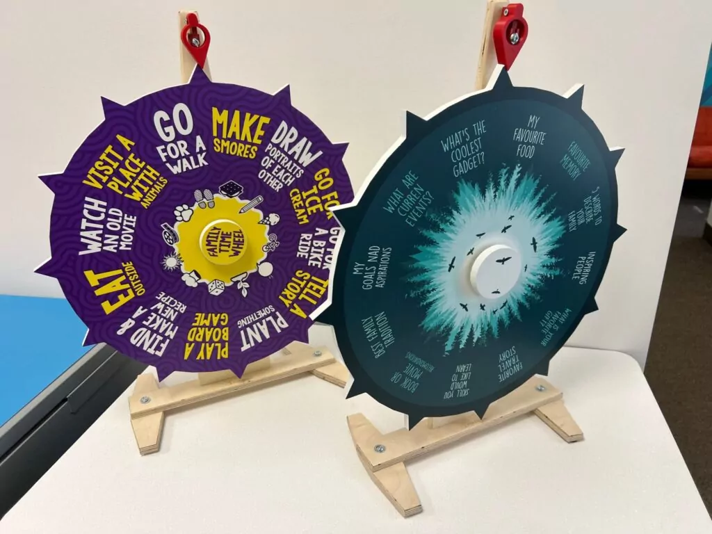 Custom spin wheels with vibrant designs and interactive segments, used to engage event participants.