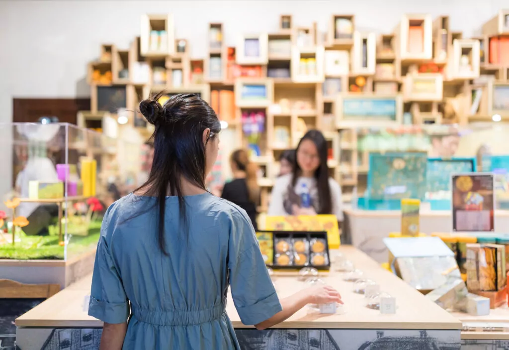Woman picking product from countertop display