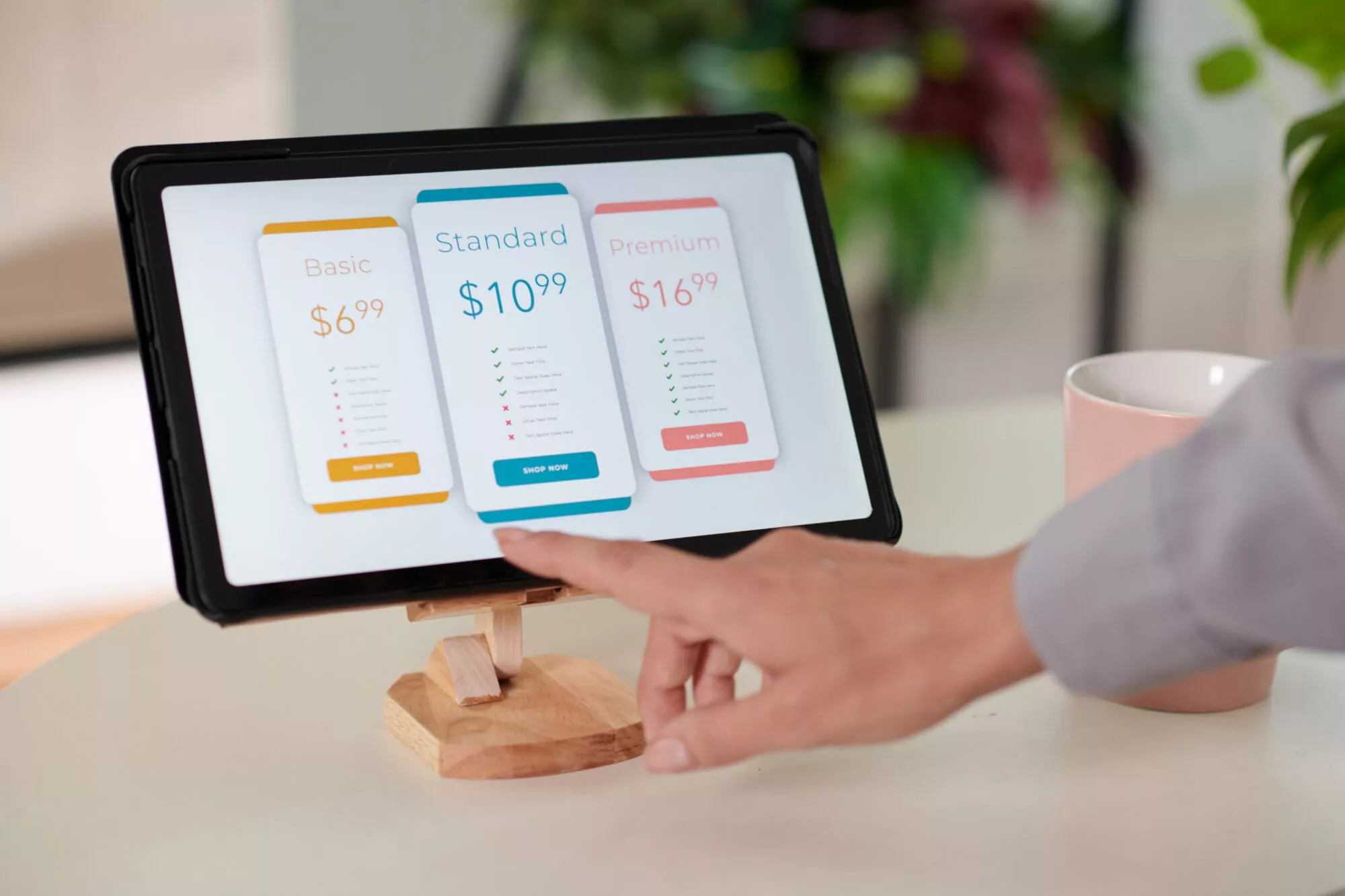 Customer selecting a pricing option on an interactive in-store kiosk with touch screen.